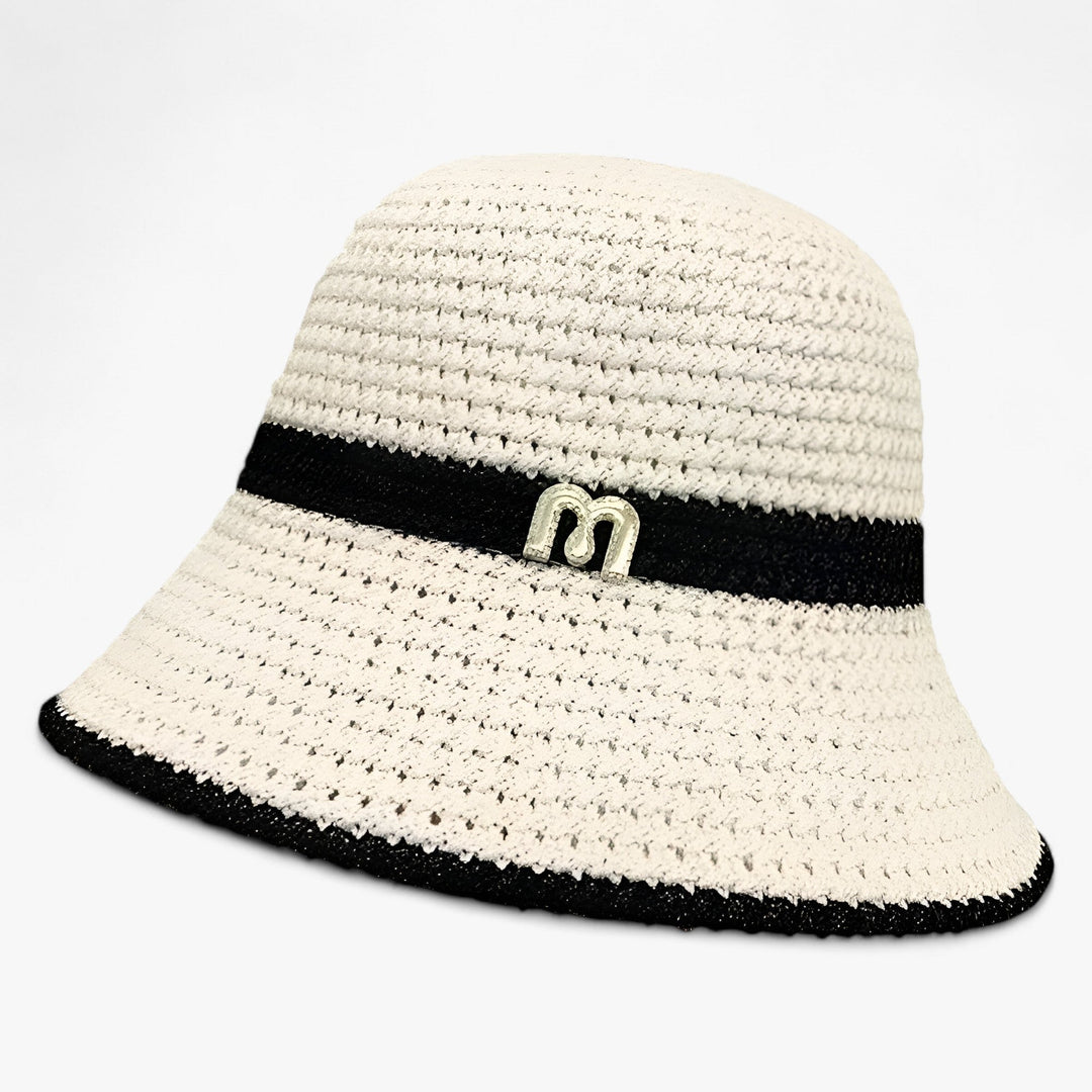 Stylish white wide brim sun hat for women, a foldable summer travel essential and beach accessory