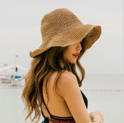 Khaki wide-brim women's summer beach hat for sun protection, perfect for vacation