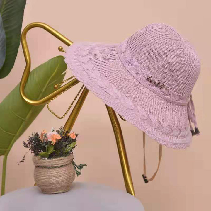 Stylish pink women's summer beach hat, breathable and fashionable accessory for sunny days