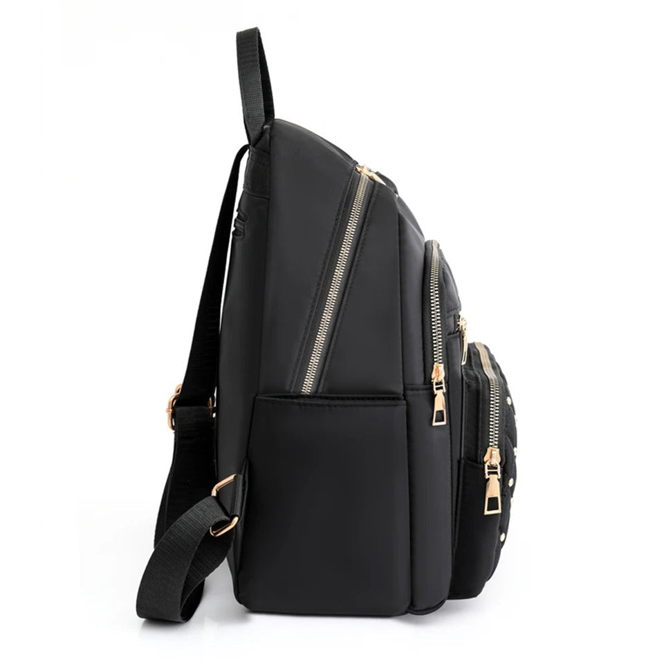 Front view of a khaki women's nylon backpack with multiple pockets, suitable for school or daily use.