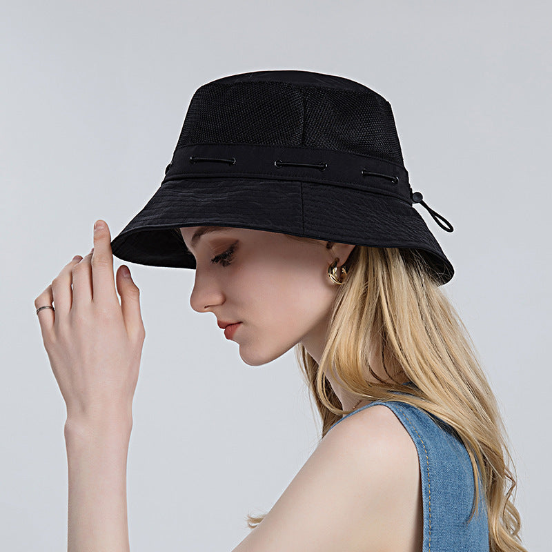 Close-up of navy blue breathable sun hat with wide brim, ideal for outdoor fashion & sun protection