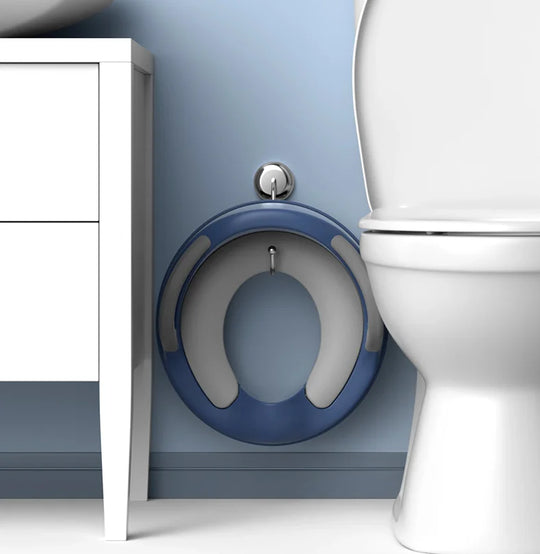 Toddler potty training toilet seat with secure handles, anti-slip pads & splash guard for safe, hygienic use.