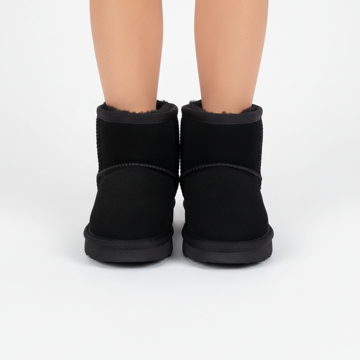 Kids' waterproof winter boots with easy-on straps, warm and cozy for cold weather adventures