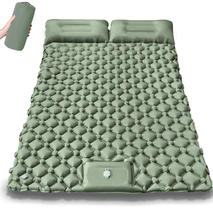 Kieran Double Inflatable Camping Mattress in a natural setting, perfect for comfortable travel