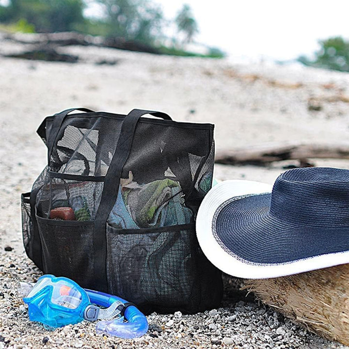 Spacious, foldable mesh carryall tote for beach, pool, travel, and outdoor family adventures with 9 pockets.