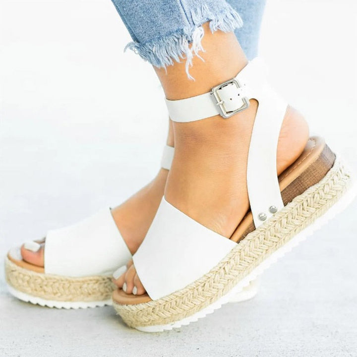 Trendy Leona women's high heel zipper sandals. Comfortable block heel, ankle strap, and open toe.