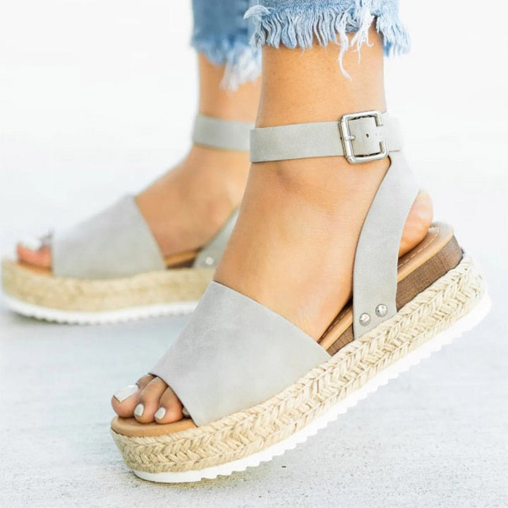 Leona women's fashion sandals with high block heel. Zipper, peep toe, and stylish summer design.