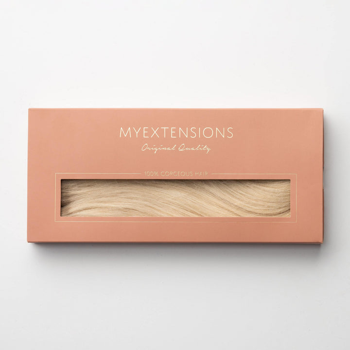 Complete set of Light Ash Blonde 60B clip-in human hair extensions, ideal for natural volume & length.