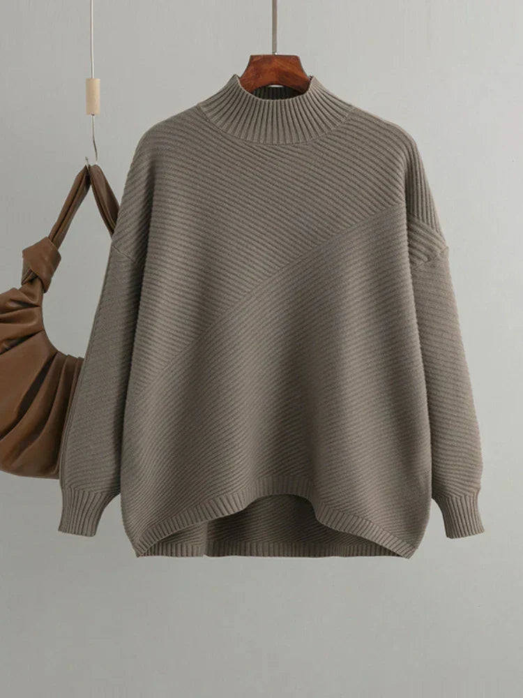 Light brown women's classic ribbed knit sweater. Oversized, round neck, comfortable casual fashion.