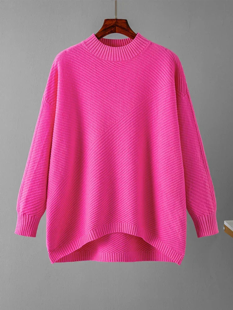 Pink ribbed knit women's sweater. Classic round neck design, versatile for casual fashion.
