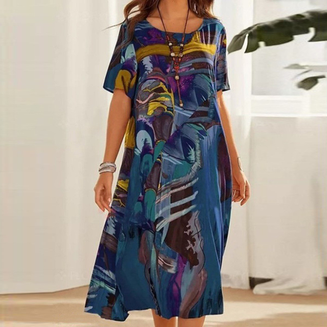 Light & loose women's summer midi dress, perfect for effortless casual style or vacation wear. Short sleeve design.