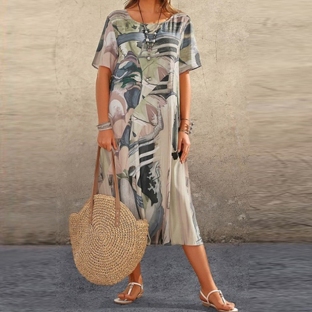 Chic women's loose summer midi dress with short sleeves, offering effortless style for casual and vacation fashion.