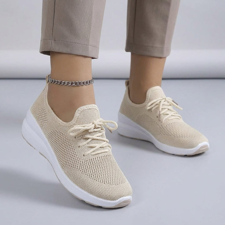 Side view of a women's everyday sneaker with a flexible sole, ideal for walking and casual wear.