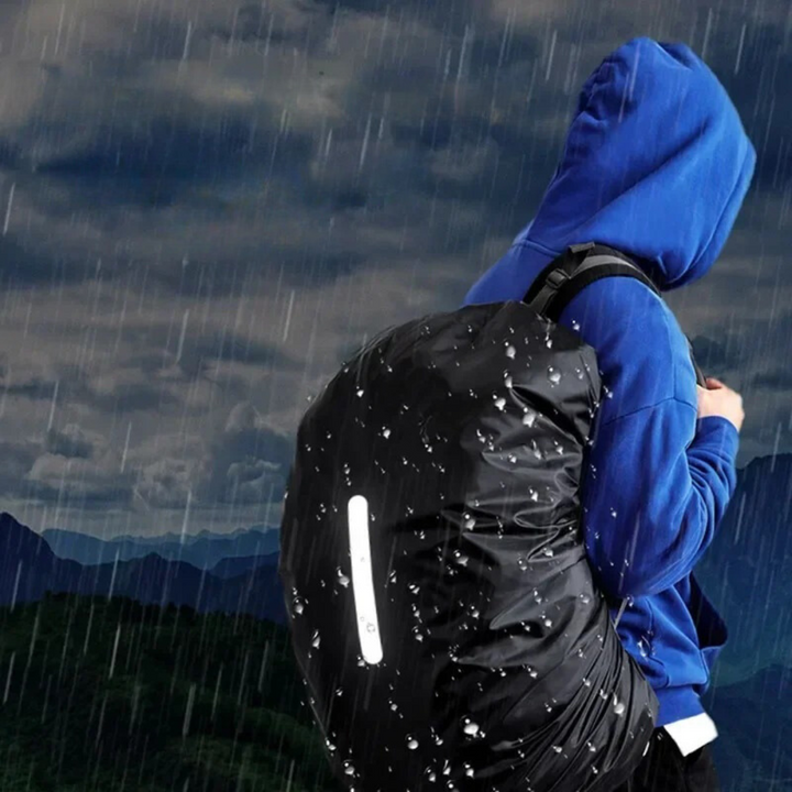 Reflective outdoor gear: a waterproof backpack rain cover, enhancing safety in low light.