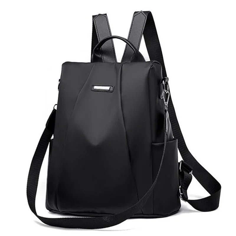 Lightweight women's water-resistant nylon backpack for travel & everyday use. Multi-way carry: shoulder, crossbody, handbag.