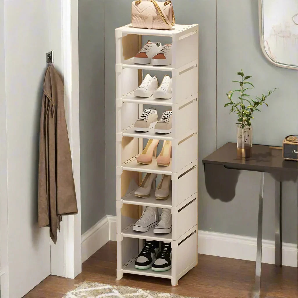 Liora space-efficient 8-tier shoe rack, black metal construction with fabric shelves, for shoe organization.