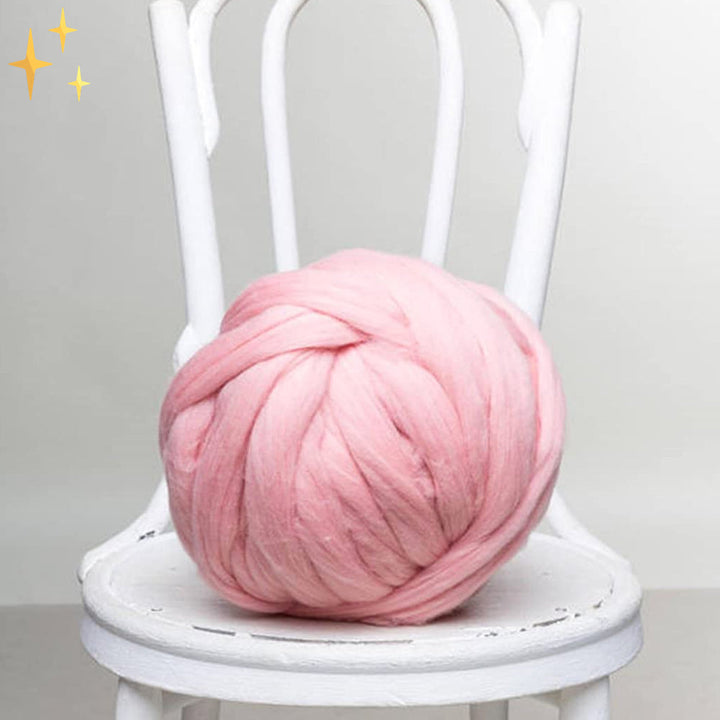Close-up of chunky wool yarn texture, emphasizing its softness and robust quality for knitting.