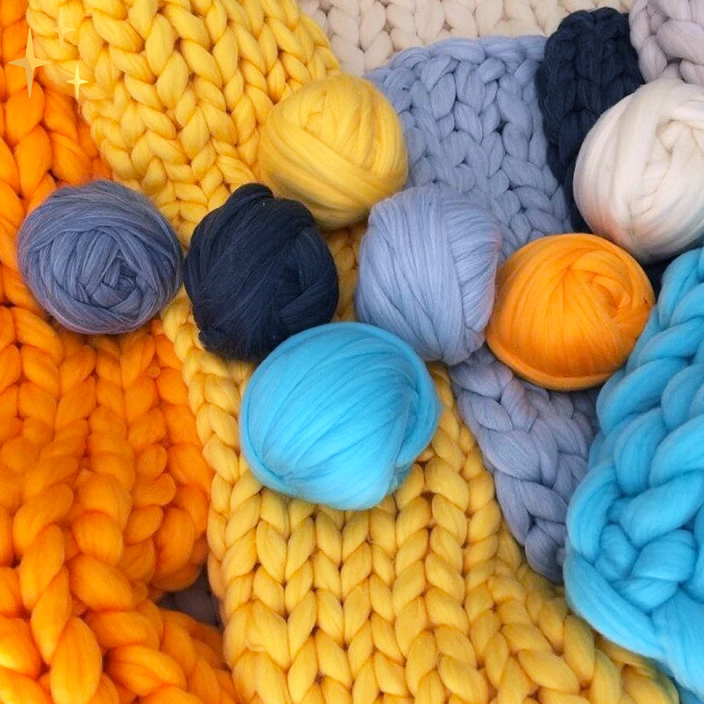 Assortment of colorful chunky Wooluxe yarns, suitable for diverse knitting and crochet crafts.