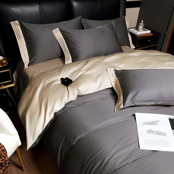 Soft satin cotton duvet cover set with intricate embroidery, a touch of luxury.