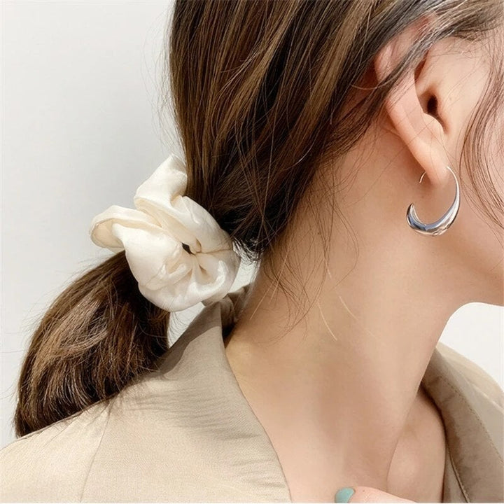 Women's luxury hoop earrings available in stunning gold-plated & silver. Elegant, versatile fashion jewelry.