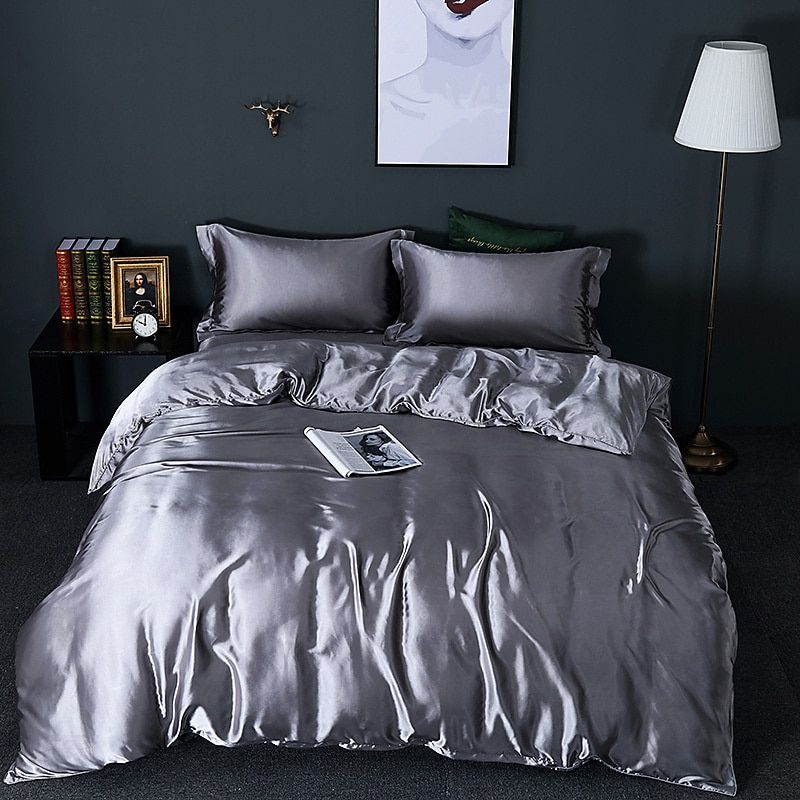 Close-up of a luxurious silk-satin duvet cover, showing smooth texture for better sleep