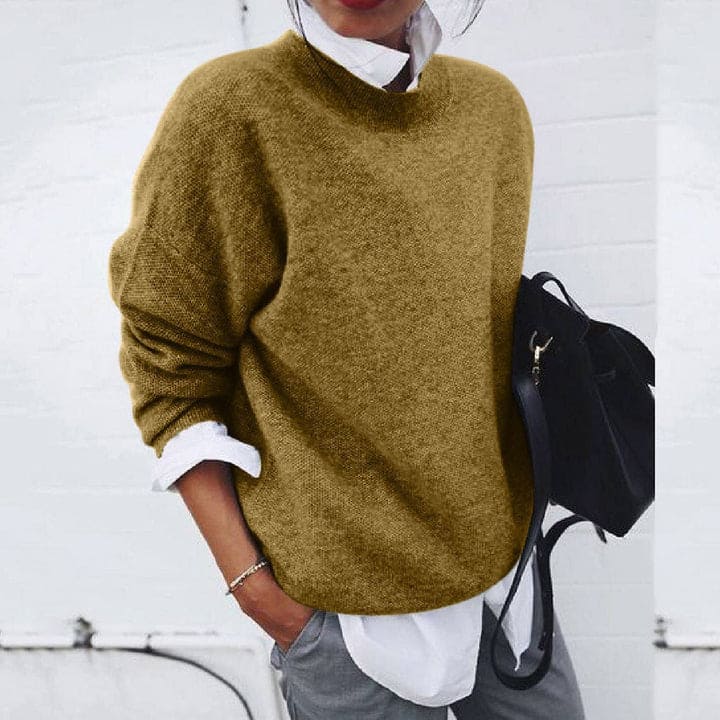 Luxurious women's soft cashmere winter sweater. Elegant and cozy long sleeve top for cold weather fashion.