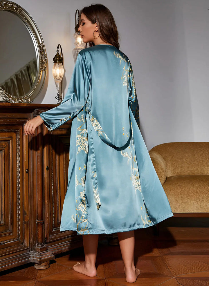 Chic black slip dress and coordinating robe loungewear for women. Stylish two-piece nightwear.