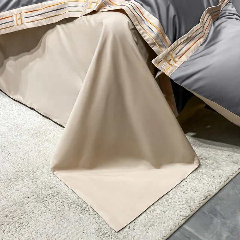 Neatly folded 4-piece luxury satin bedding set. Ready to bring soft, smooth comfort & elegance to any bedroom.