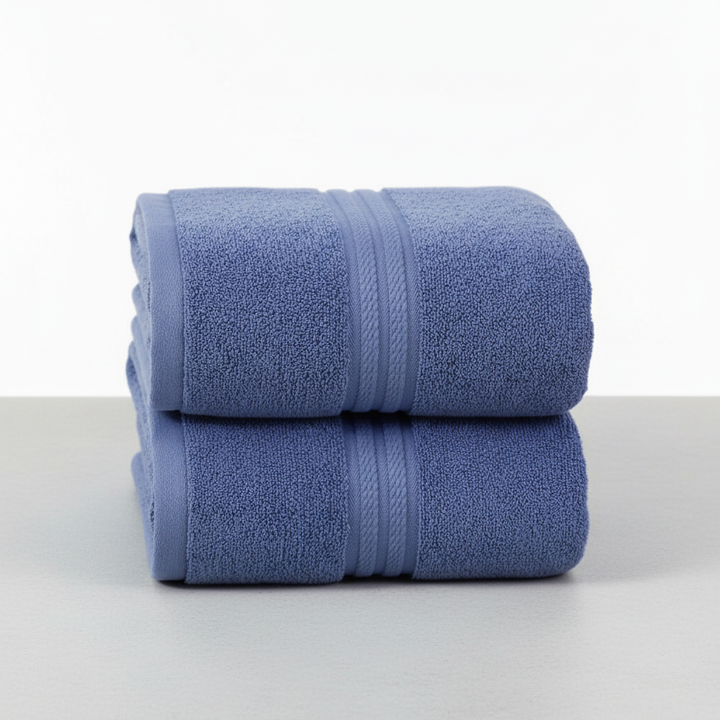 Elegant cotton bath towel set in a neutral cream color, soft and absorbent for daily use