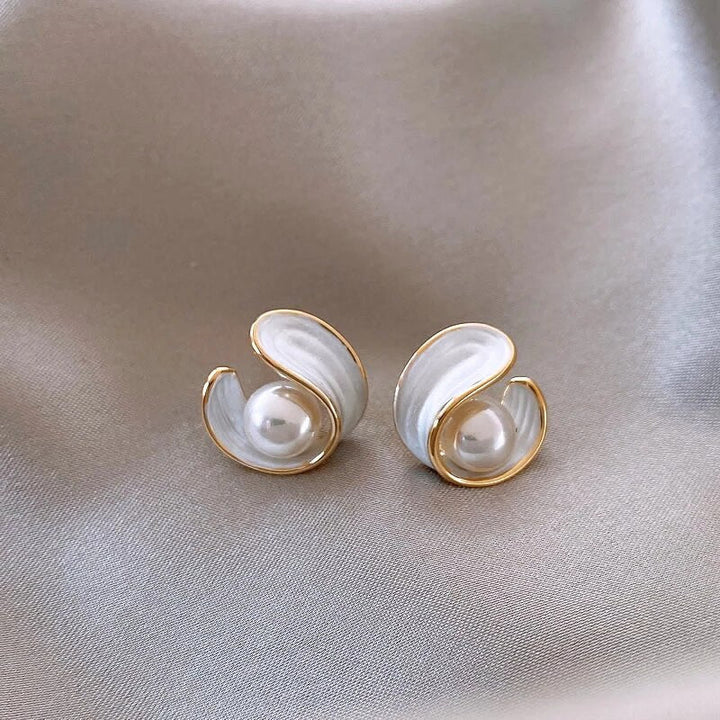 Elegant women's gold drop earrings featuring shimmering white opals and delicate pearls. Perfect for luxury.