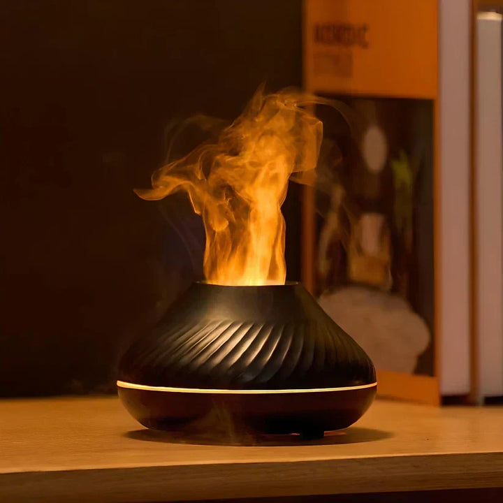 Stylish black LumoMist flame effect aroma diffuser. Humidifies & purifies air with essential oils for relaxation.