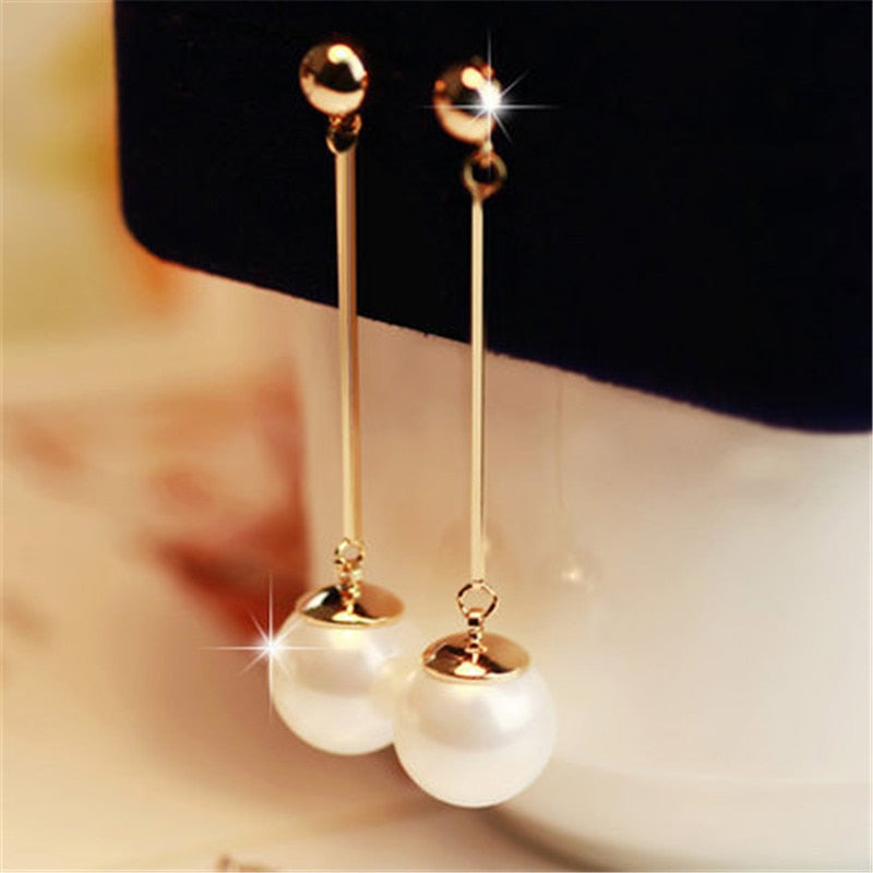 Luxury pearl drop earrings for women. Elegant, timeless design with delicate pearls, perfect for special occasions or gifts.