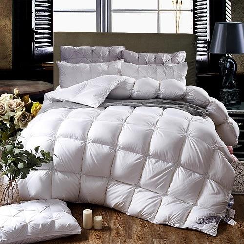 Luxury PlumeLux goose down duvet, piped edging, white cotton cover, all-season comfort & soft bedding.