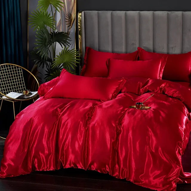Two satin pillowcases stacked, showing the smooth, reflective surface of the fabric.