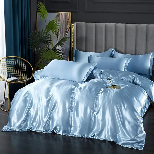 High-quality home textiles: a complete silky satin bedding set in a serene bedroom setting.