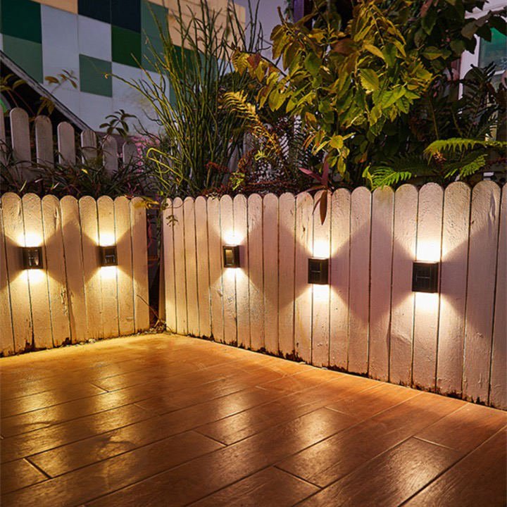 Eco-friendly wireless solar LED lamp mounted on an exterior wall, providing home security lighting.