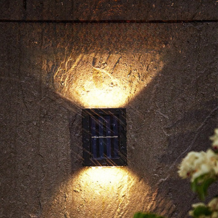Modern garden decor featuring a wireless solar LED wall lamp, perfect for outdoor lighting.