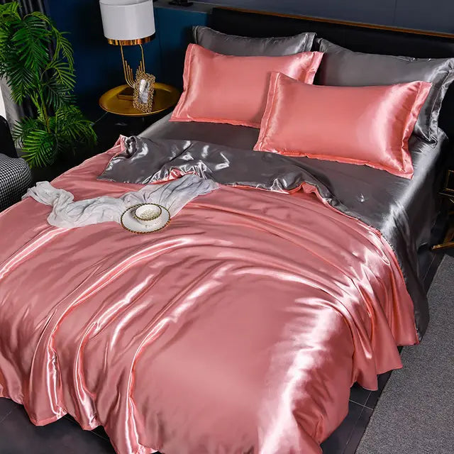 Solid satin duvet cover set with matching shams, creating a cohesive luxury bedroom look.