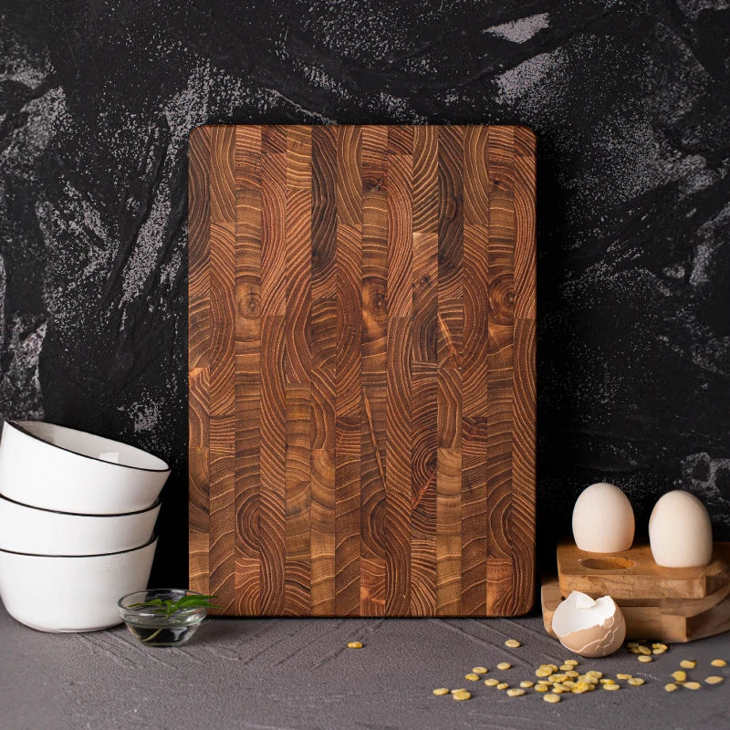 Beautiful natural teak wood cutting board, a durable and luxurious kitchen accessory for all your food prep needs.