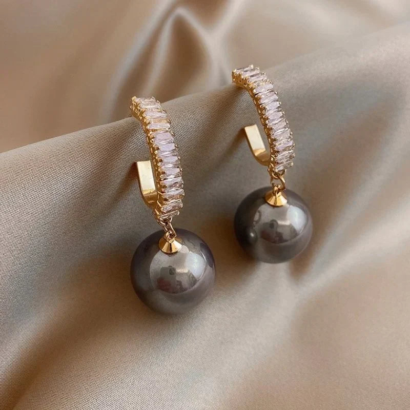 Luxury women's pearl & zirconia drop earrings. Elegant fashion jewelry, perfect for weddings or special occasions.