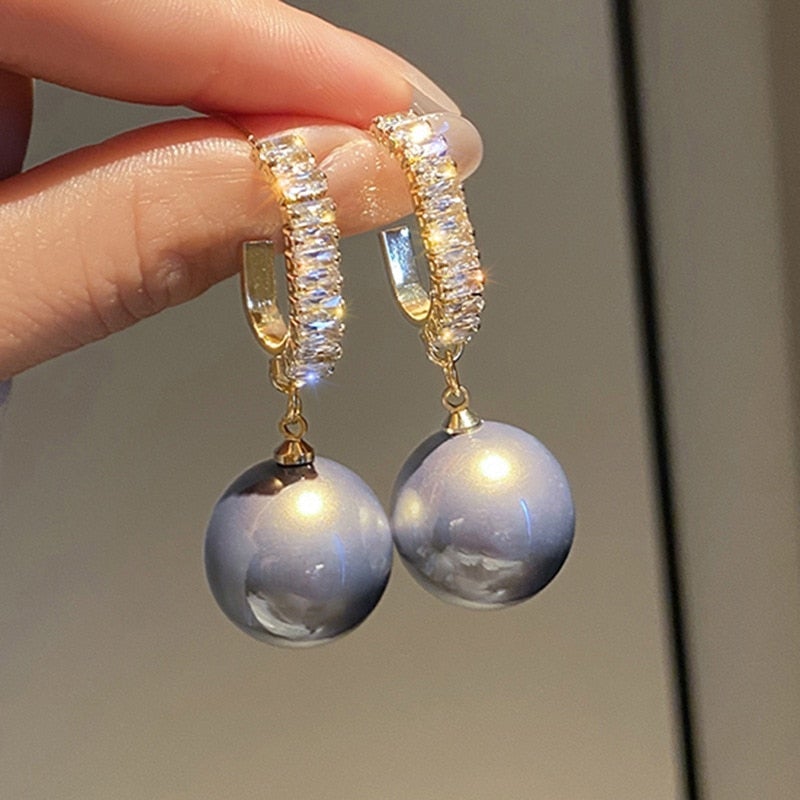 Exquisite pearl & zirconia drop earrings for women. Sparkle with these elegant luxury accessories, ideal for gifts.