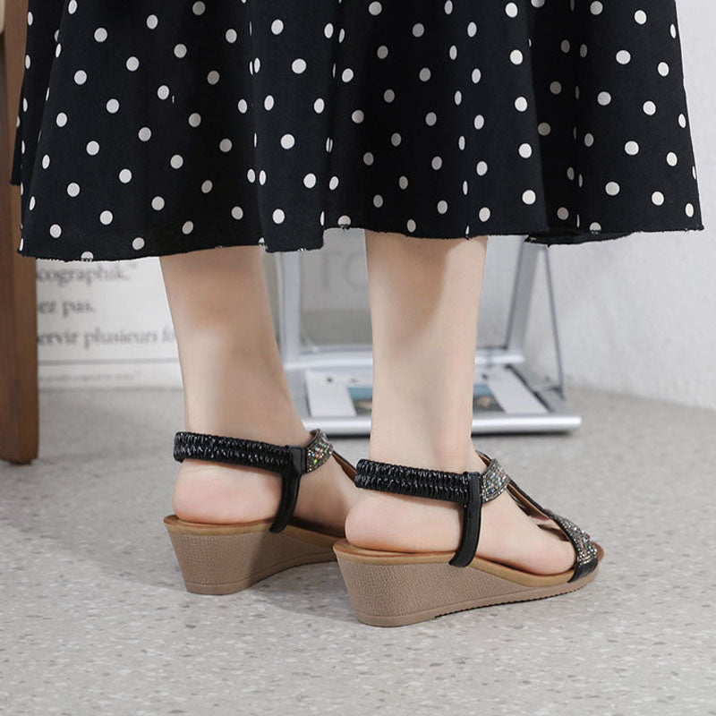 Glamorous ladies' summer wedge sandals, exquisitely detailed with shimmering rhinestones.