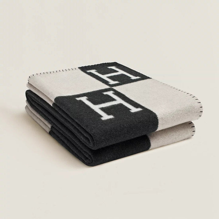 Elegant gray and white plaid wool cashmere throw, perfect as a decorative throw blanket for sofa or bed.