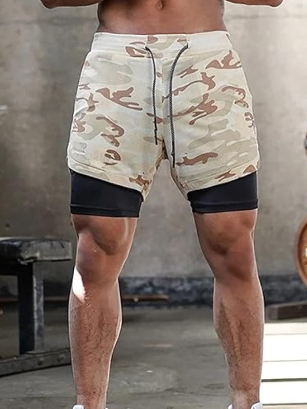 Men's athletic shorts with inner compression layer, ideal for running and training.