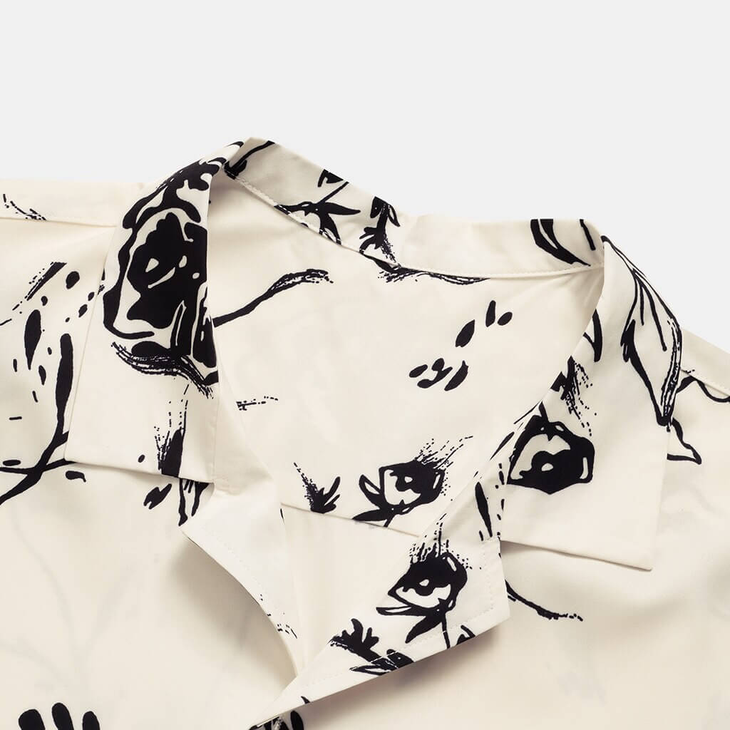 Full shot of a men's modern tropical print casual shirt for summer, suitable for beach or resort.