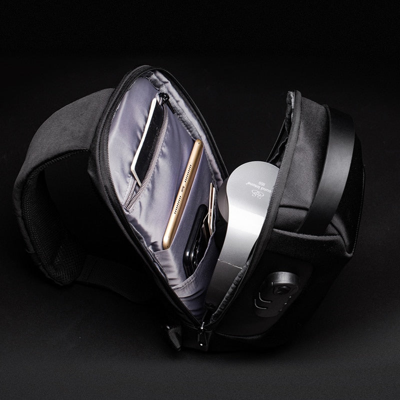 Secure men's water-resistant crossbody bag with anti-theft design and integrated USB charging.