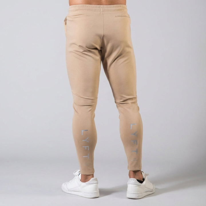 Men's activewear tapered joggers, elastic waist for a secure fit, great for sports and casual style.