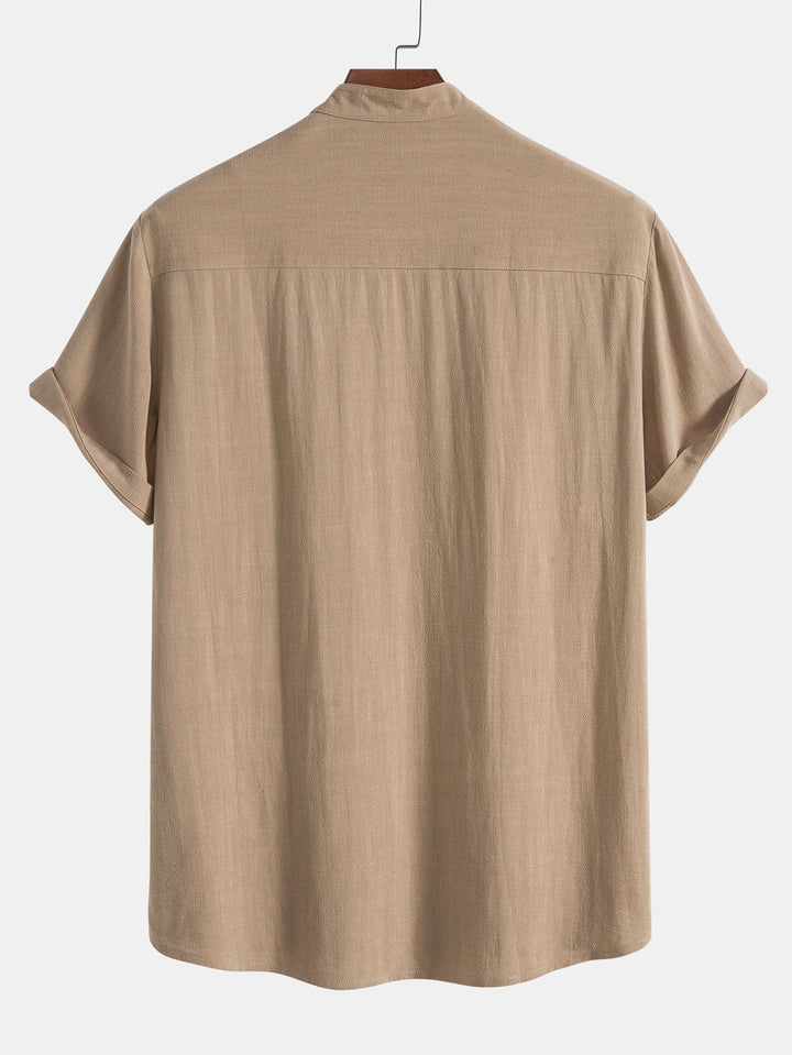 Detail of beige men's slim fit linen short sleeve top, part of a modern two-piece co-ord outfit set.