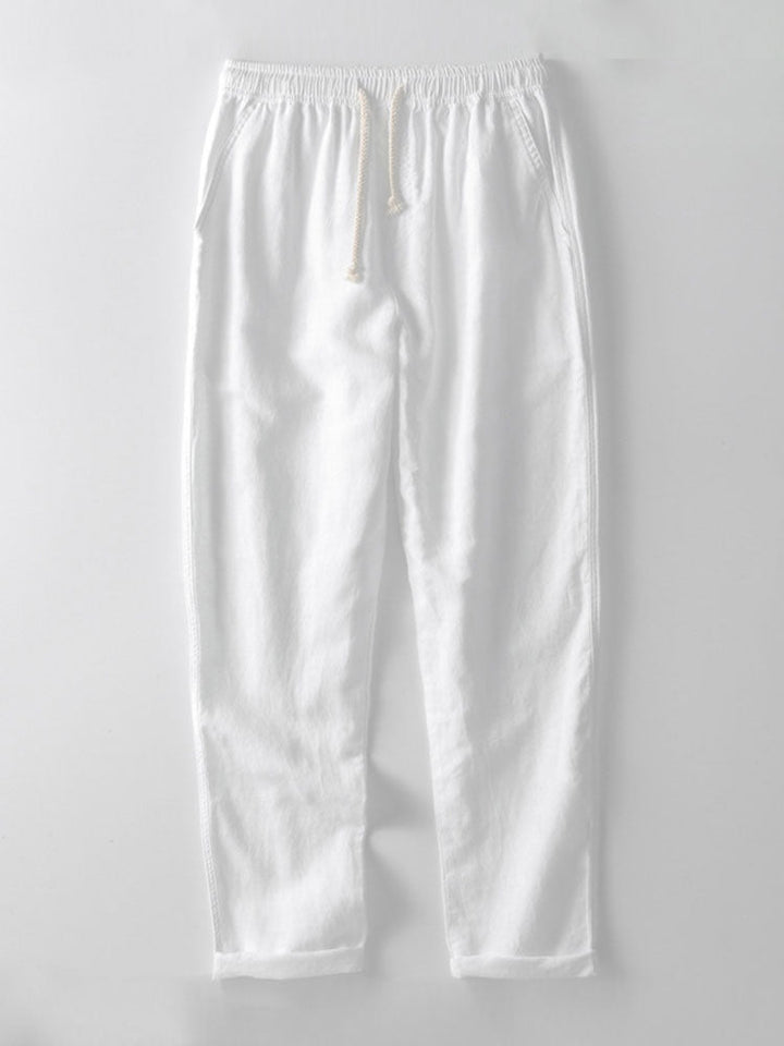 Gray modern men's slim fit linen co-ord set. Matching short sleeve top and ankle pants for smart casual style.