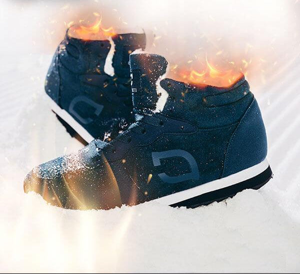 Men's Bjorn snow boots tackling icy winter terrain. Warm, water-repellent, anti-slip outdoor footwear.
